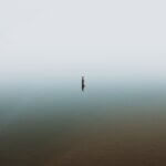 person in body of water during daytime